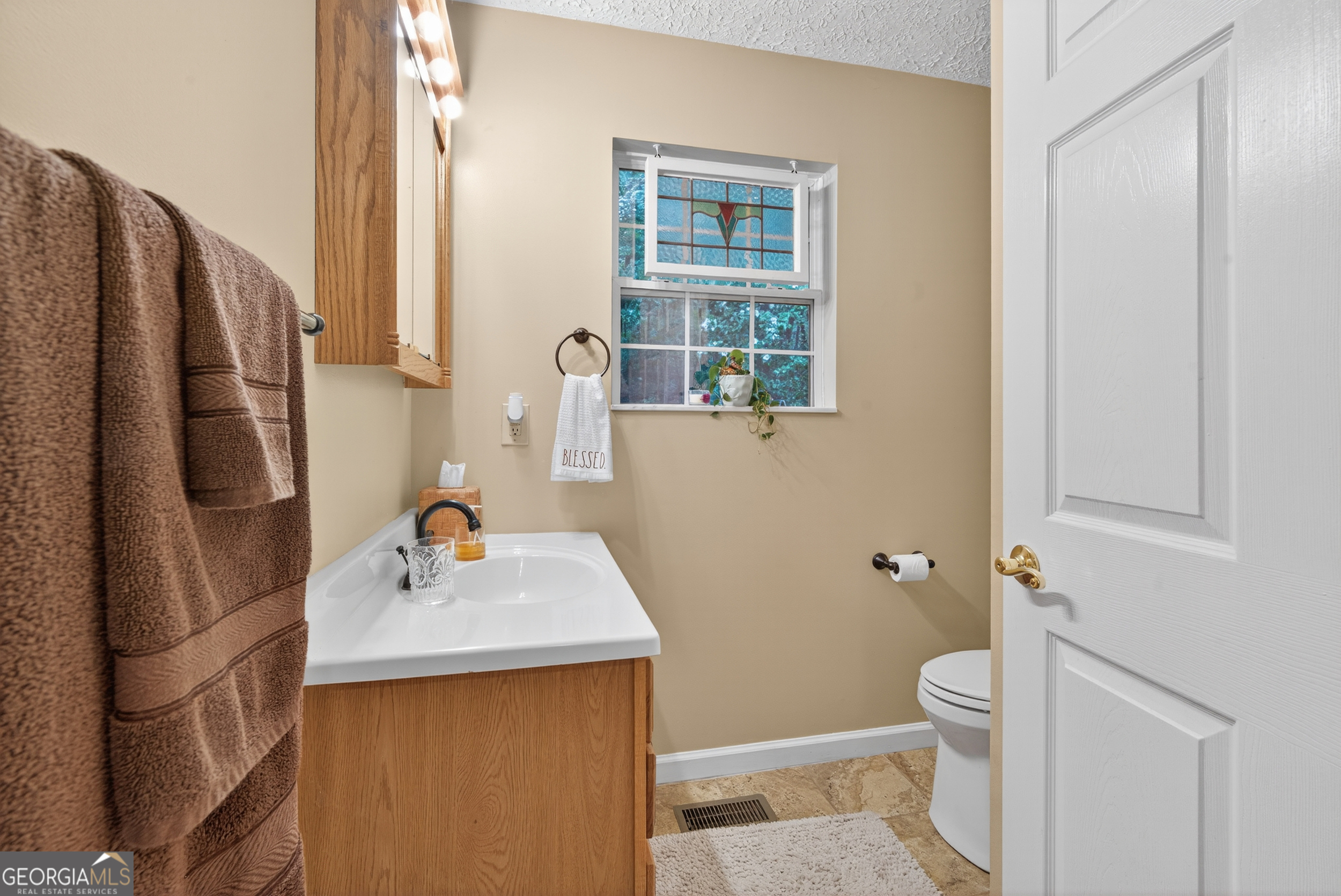 75 Juniper Trail Clayton, GA 30525 - Photo 15 of 38 a bathroom with a sink toilet and shower