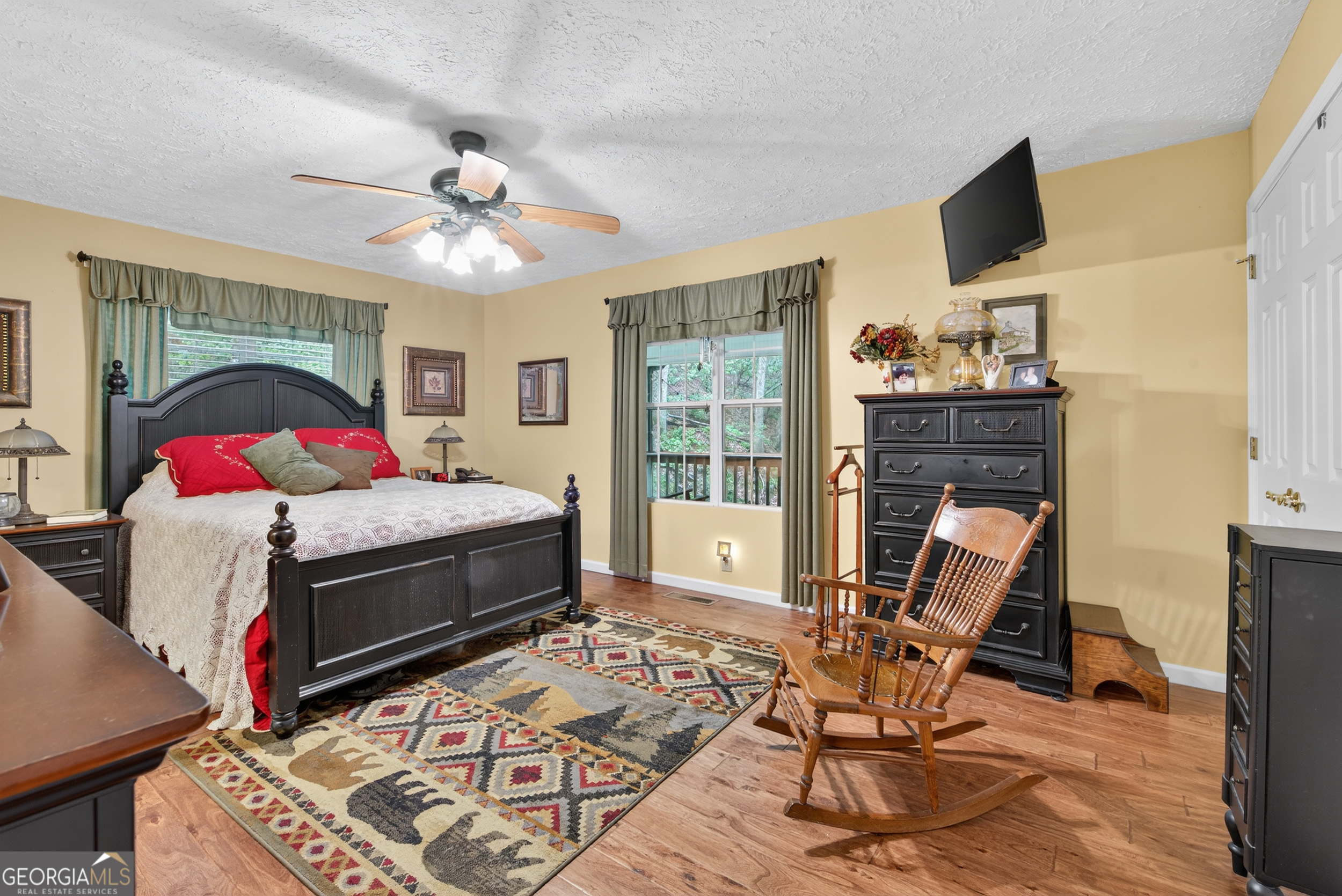 75 Juniper Trail Clayton, GA 30525 - Photo 17 of 38 a bedroom with a bed and wooden floor