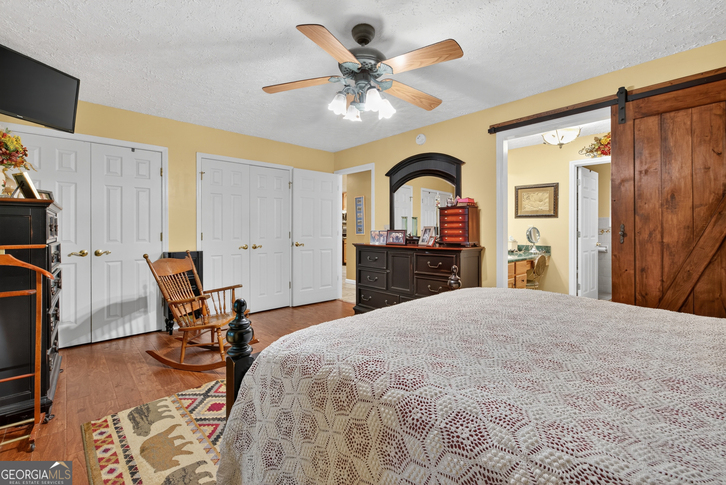 75 Juniper Trail Clayton, GA 30525 - Photo 19 of 38 a bedroom with a bed and furniture