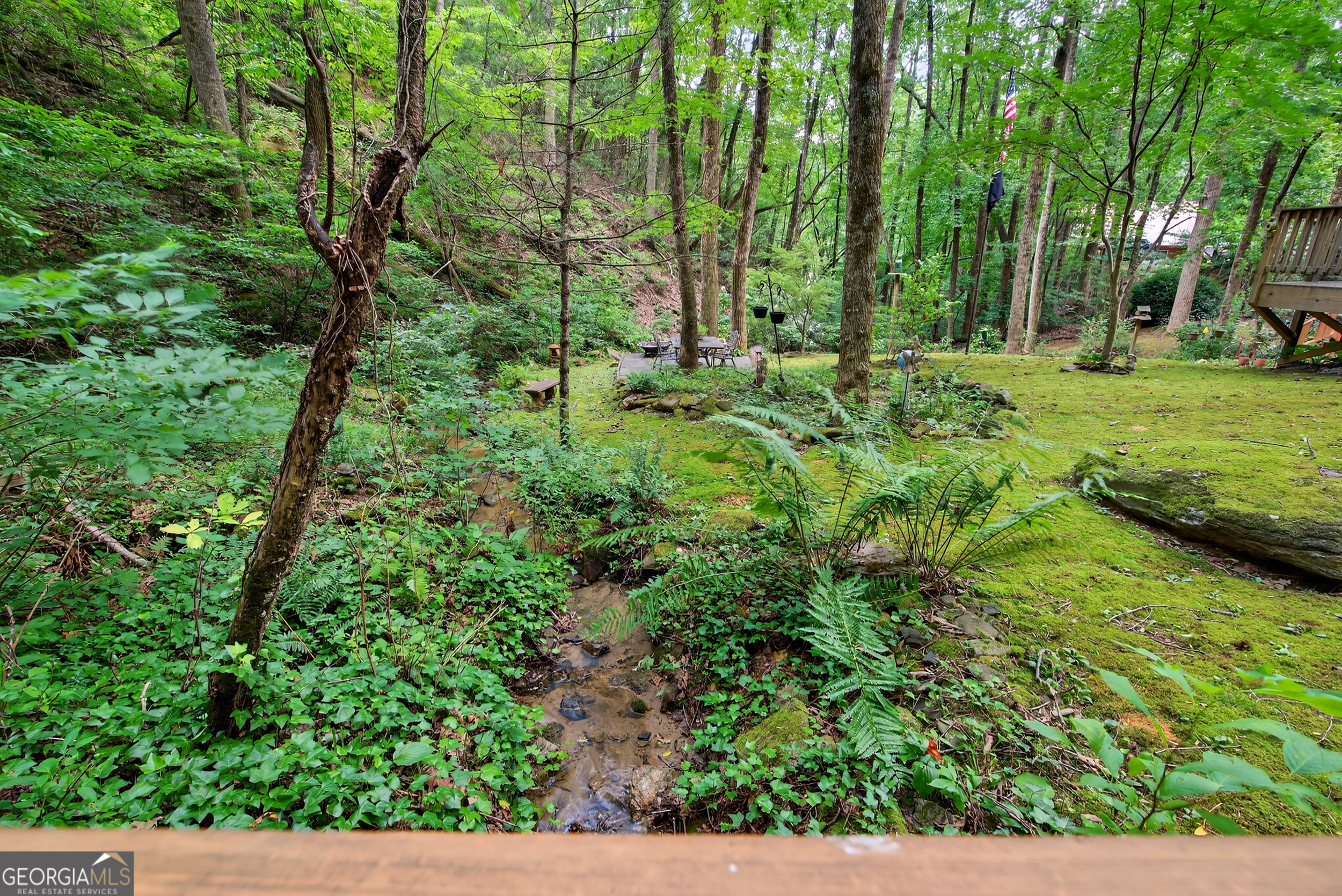 75 Juniper Trail Clayton, GA 30525 - Photo 2 of 38 a view of a garden with a building