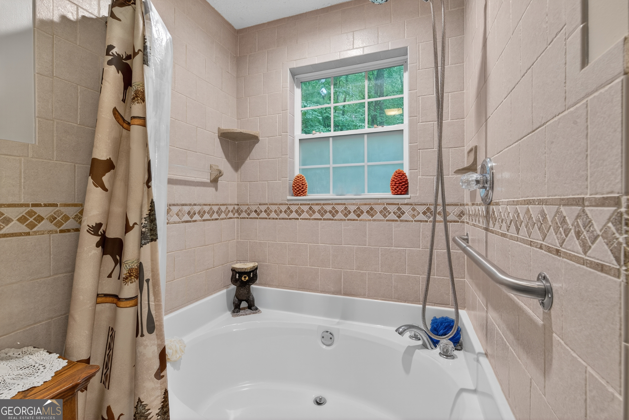 75 Juniper Trail Clayton, GA 30525 - Photo 23 of 38 a bathroom with a tub and a window