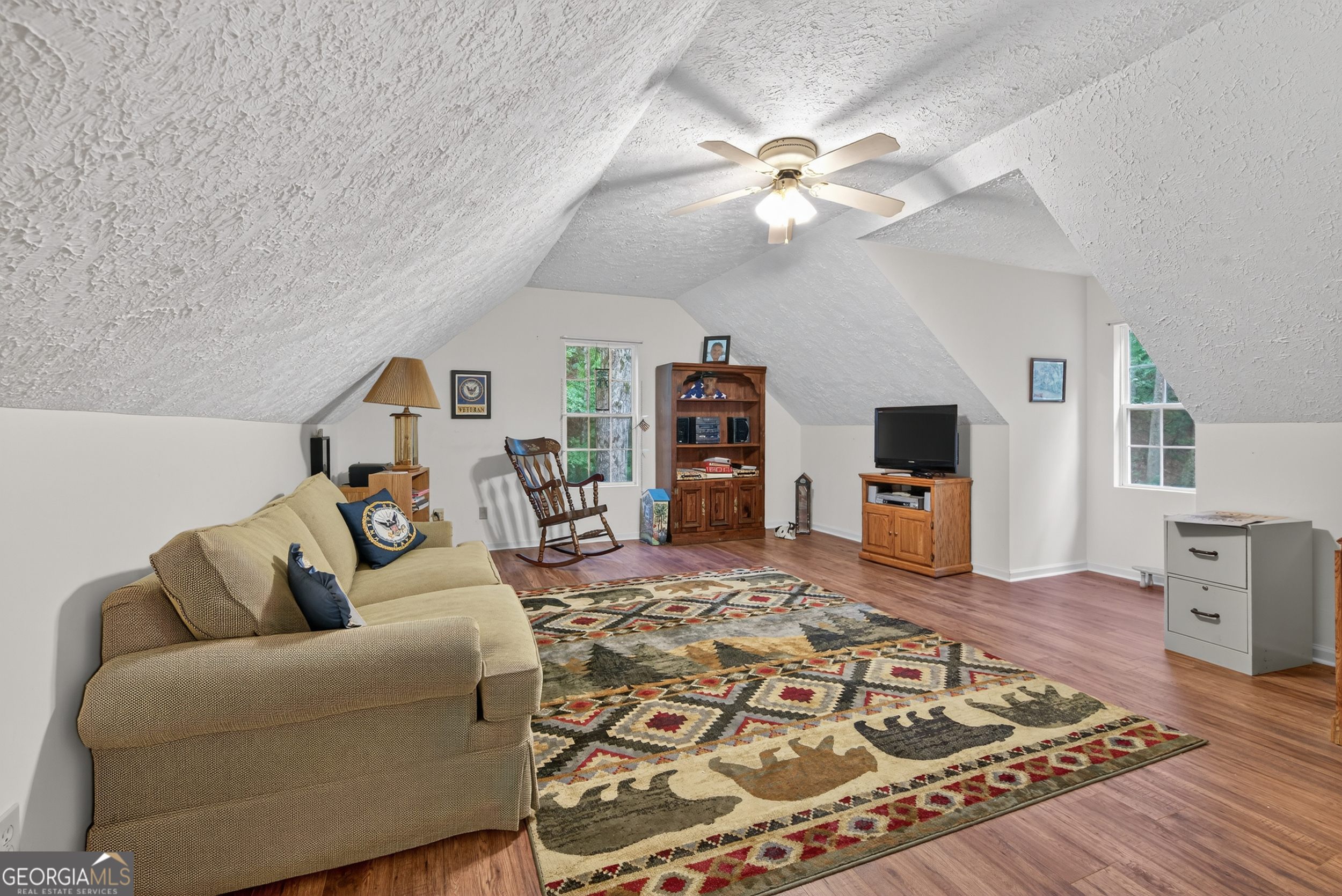 75 Juniper Trail Clayton, GA 30525 - Photo 25 of 38 a living room with furniture and a flat screen tv