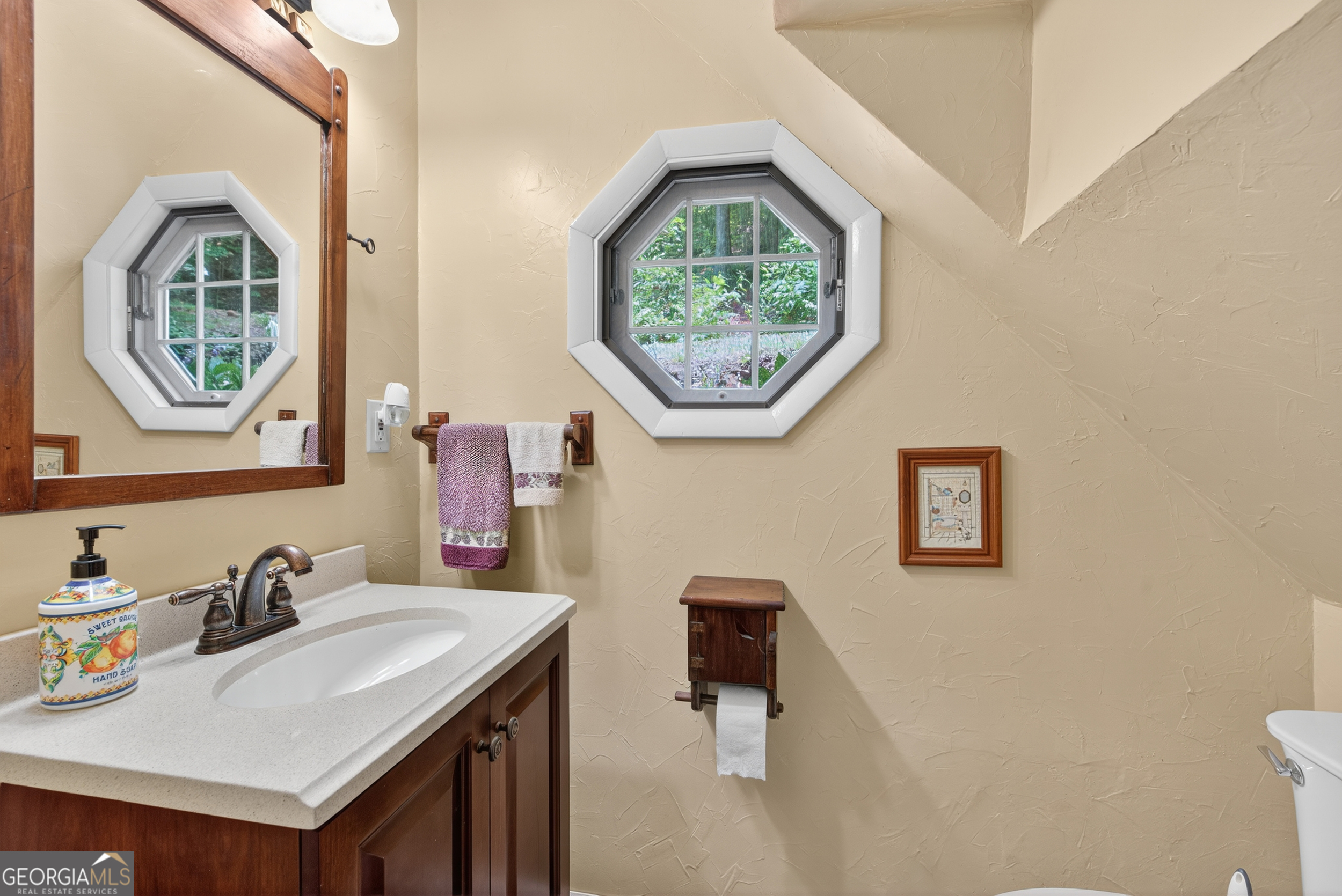 75 Juniper Trail Clayton, GA 30525 - Photo 27 of 38 a bathroom with a sink and a mirror