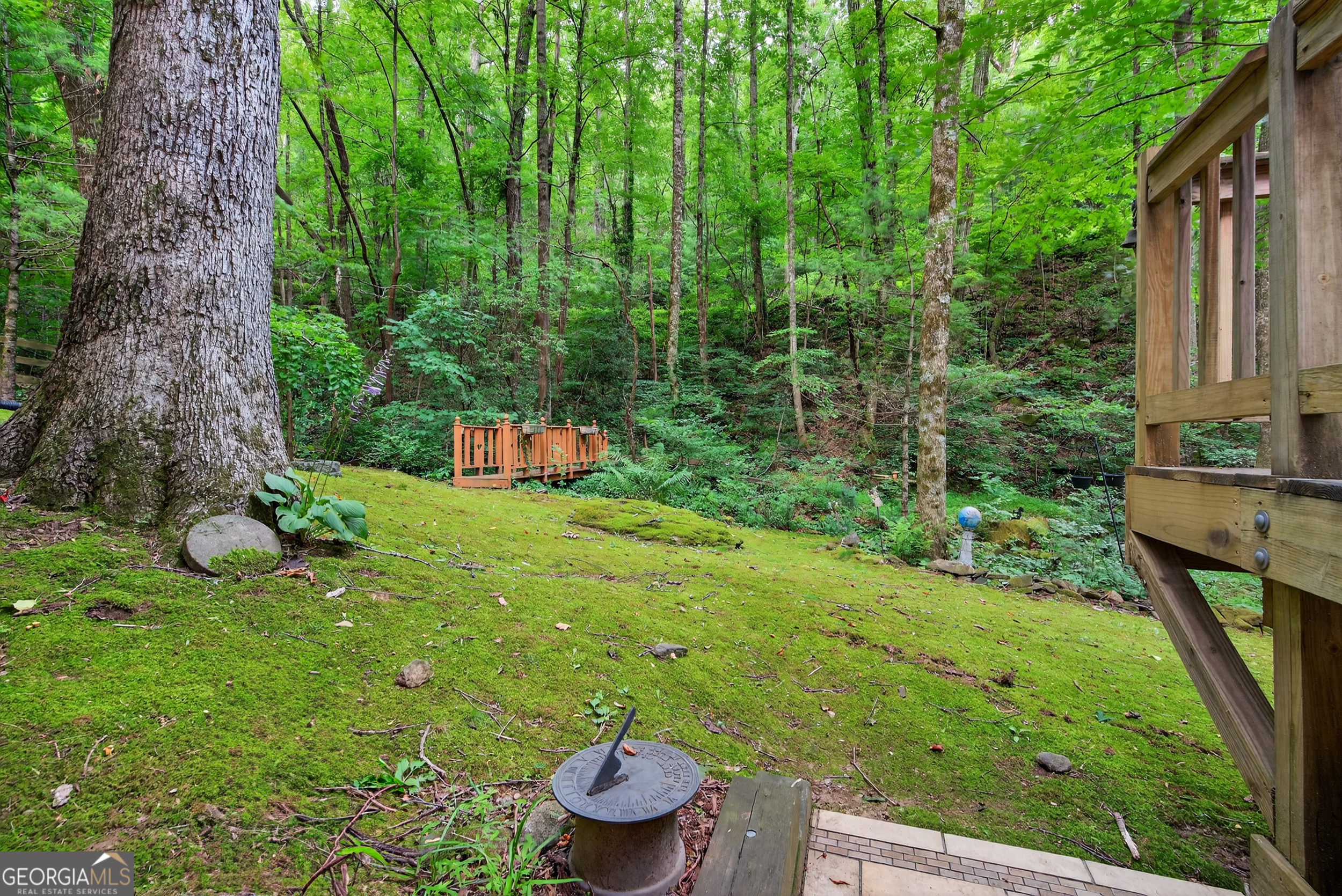 75 Juniper Trail Clayton, GA 30525 - Photo 33 of 38 a backyard of a house with lots of green space and fountain