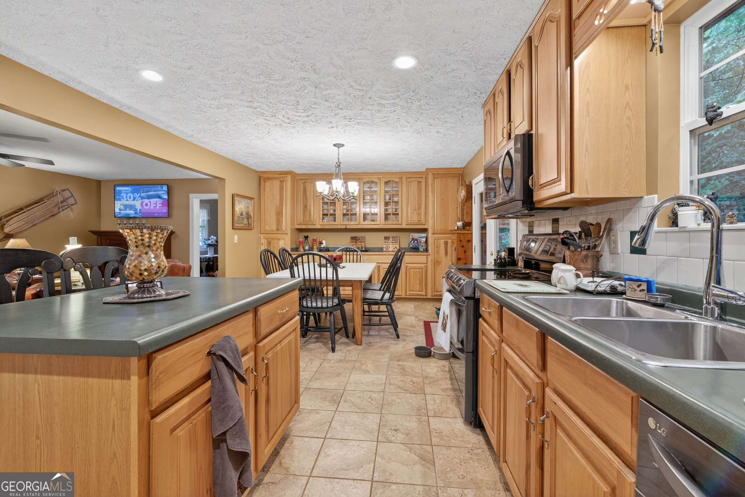 75 Juniper Trail Clayton, GA 30525 - Photo 10 of 38 a kitchen with counter top space a sink cabinets and appliances