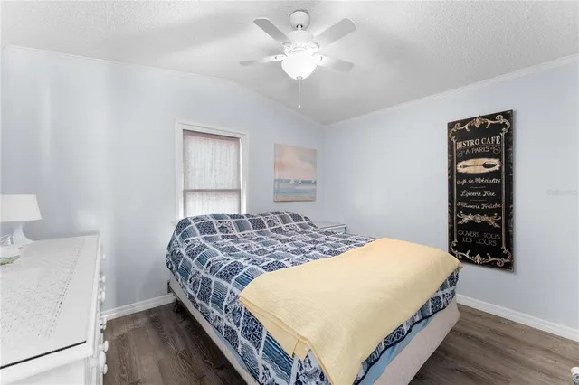 a bedroom with bed and a window