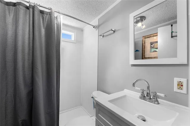 a bathroom with a sink and mirror