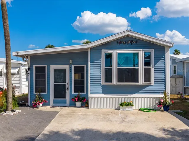 a view of a brick house with a yard
