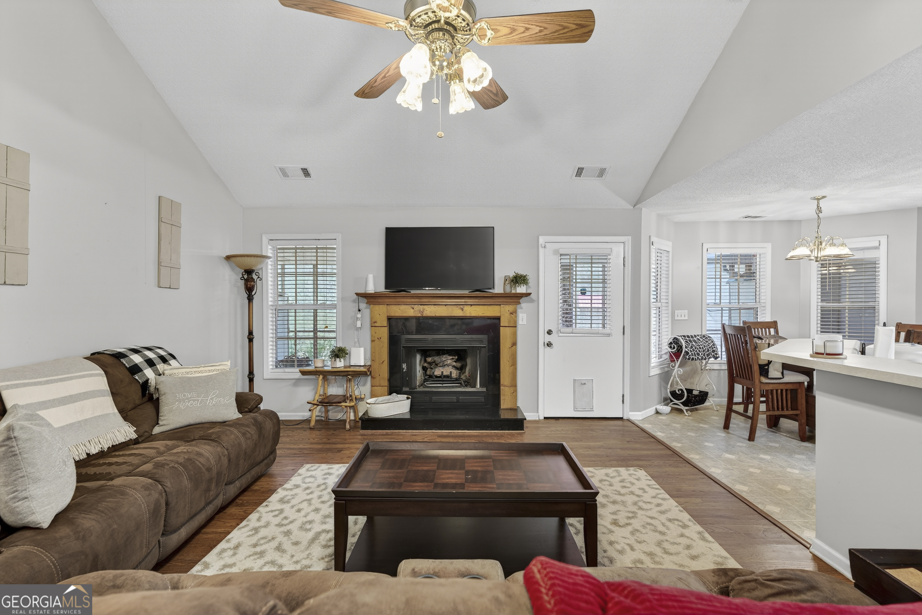 249 Southern Walk Circle Gray, GA 31032 - Photo 12 of 58 a living room with furniture a fireplace and a flat screen tv