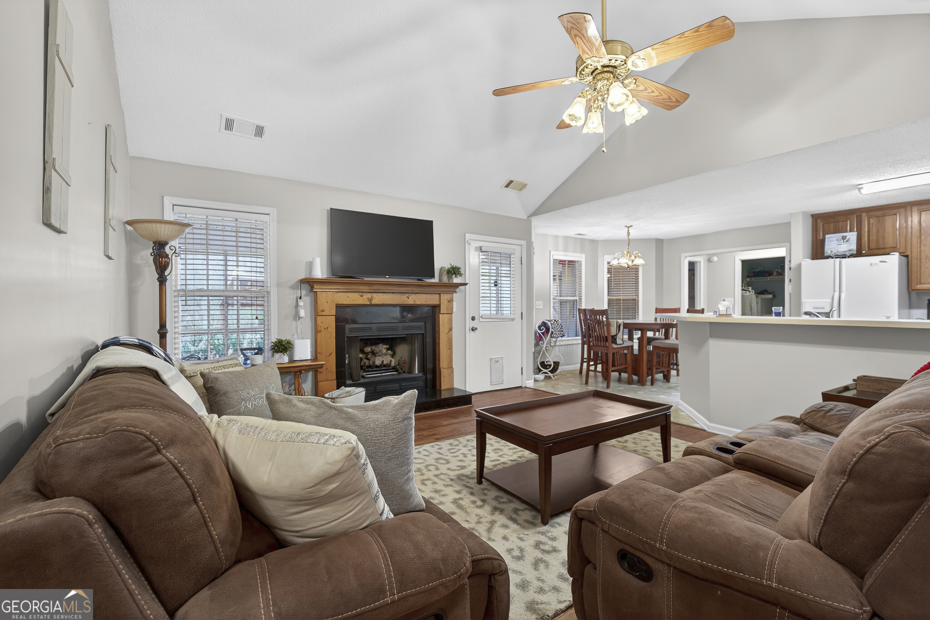 249 Southern Walk Circle Gray, GA 31032 - Photo 15 of 58 a living room with furniture a fireplace and a flat screen tv