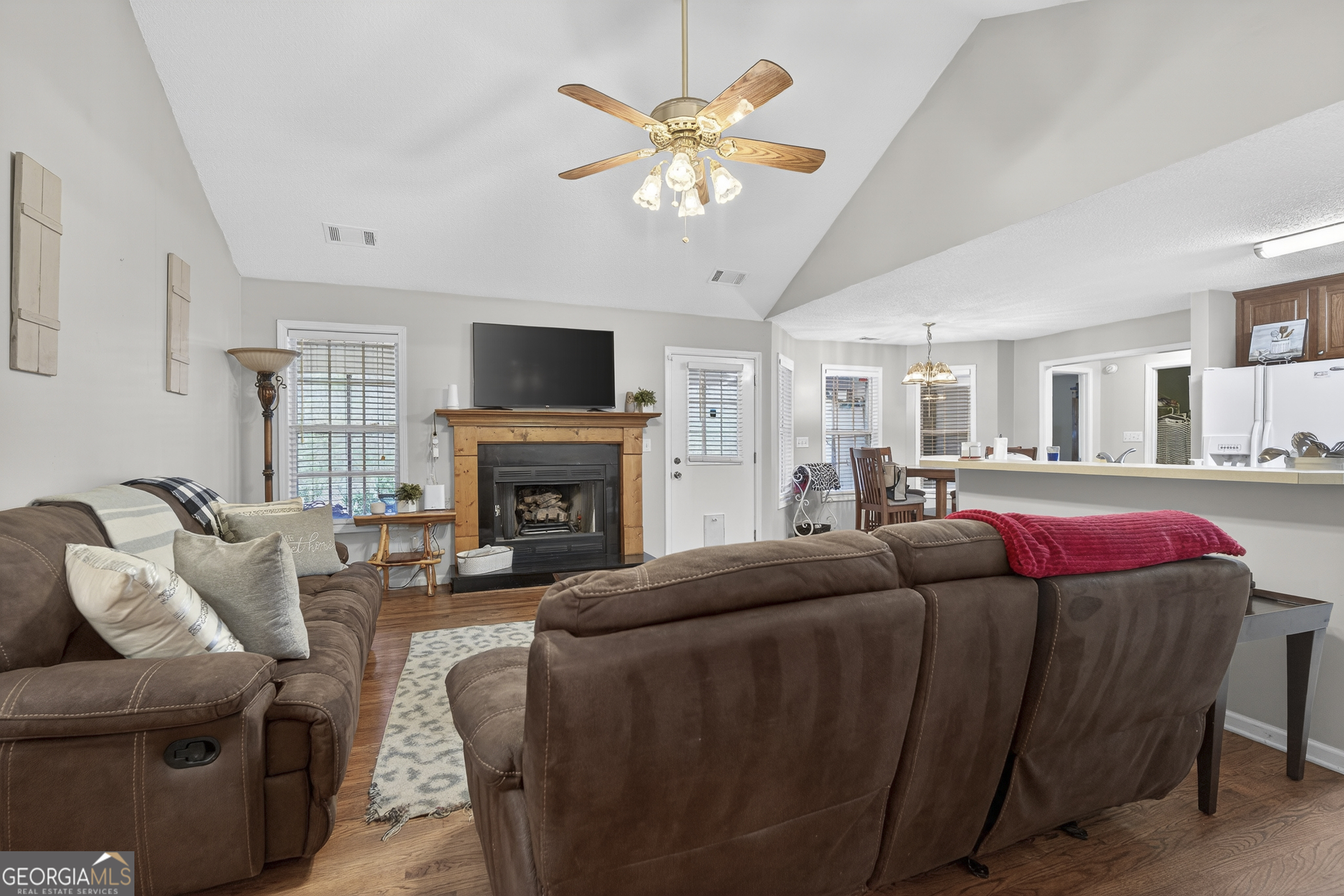 249 Southern Walk Circle Gray, GA 31032 - Photo 16 of 58 a living room with furniture a fireplace and a flat screen tv