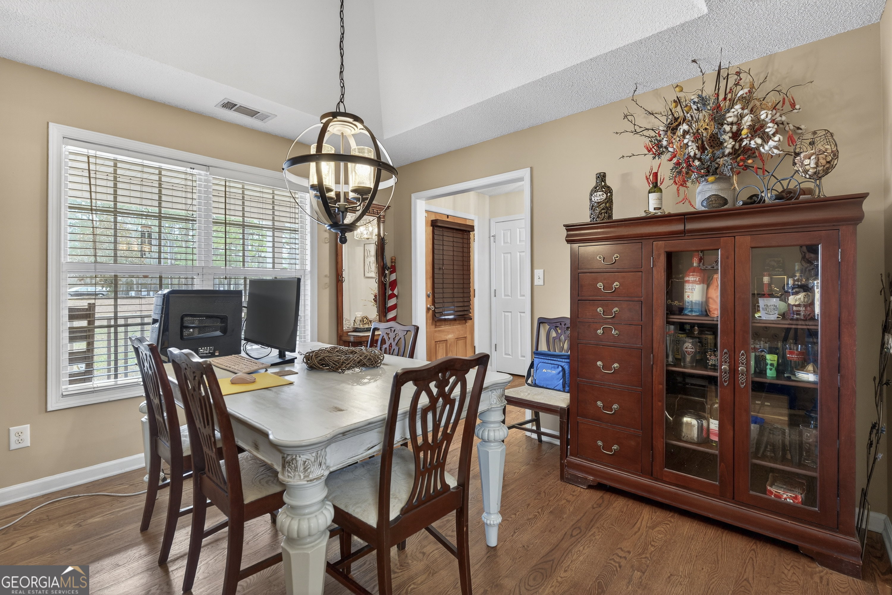 249 Southern Walk Circle Gray, GA 31032 - Photo 21 of 58 a view of a dining room with furniture wooden floor and chandelier
