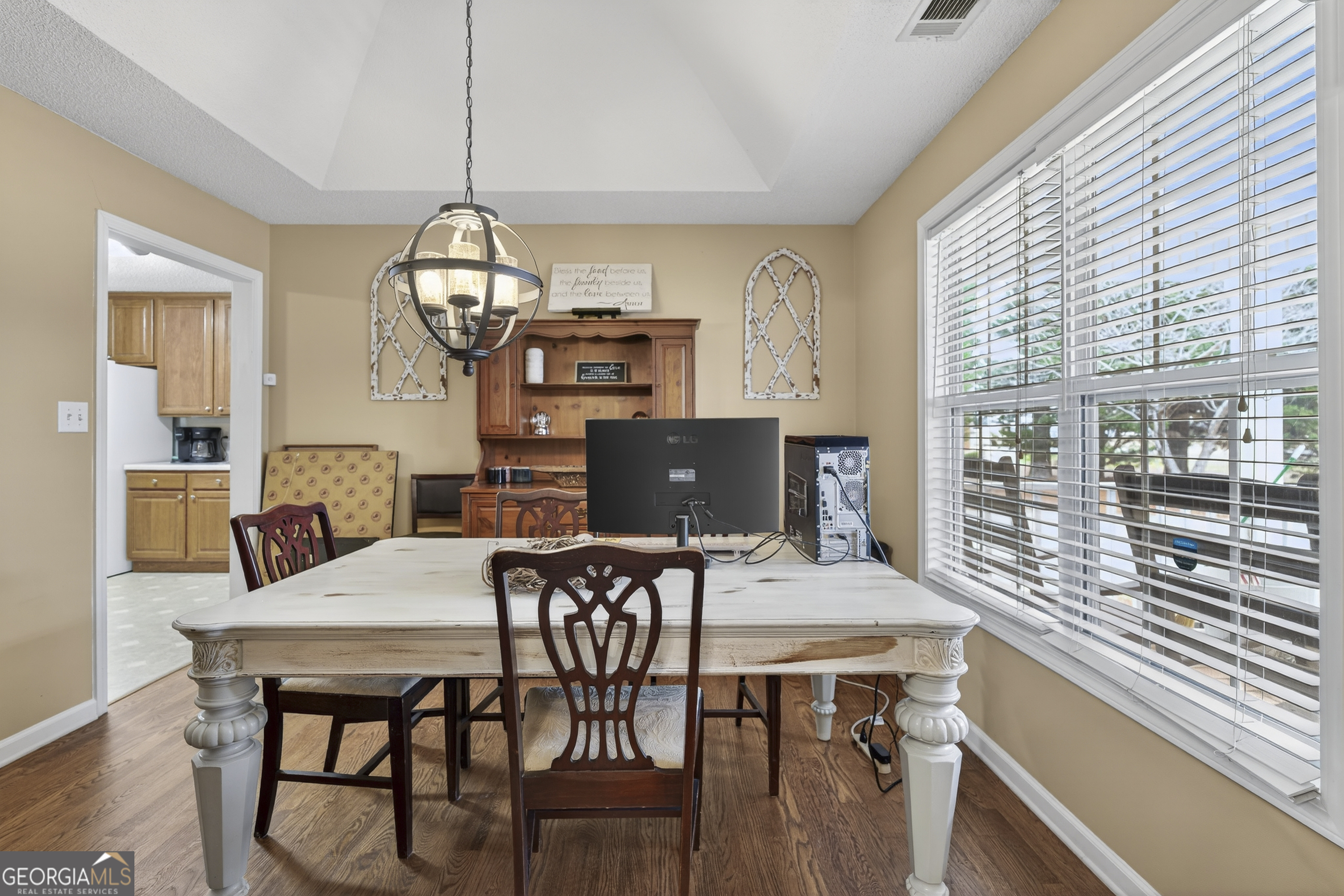 249 Southern Walk Circle Gray, GA 31032 - Photo 23 of 58 a view of a dining room with furniture window and wooden floor