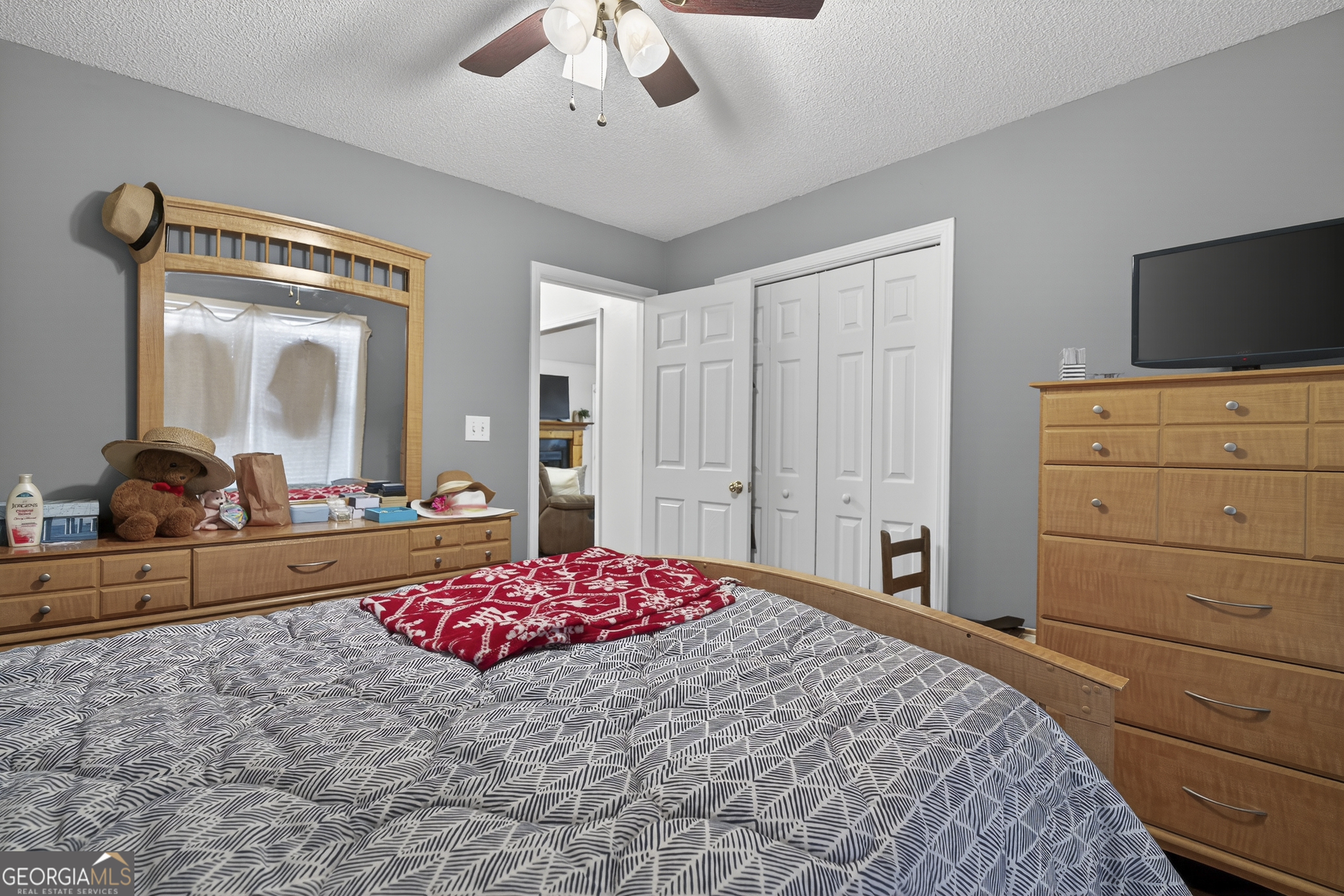 249 Southern Walk Circle Gray, GA 31032 - Photo 32 of 58 a bedroom with a bed and a dresser
