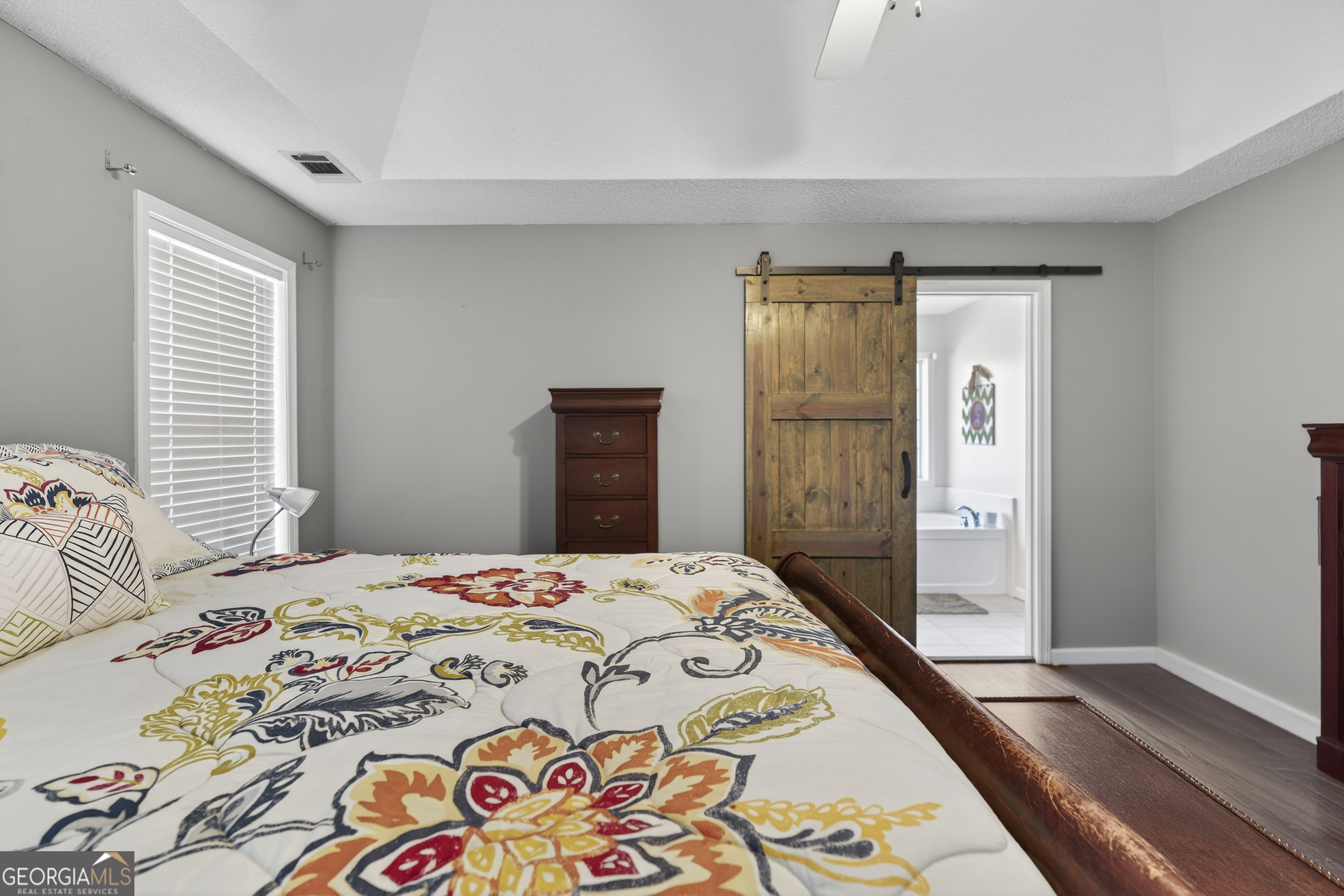 249 Southern Walk Circle Gray, GA 31032 - Photo 33 of 58 a bedroom with a bed and a dresser