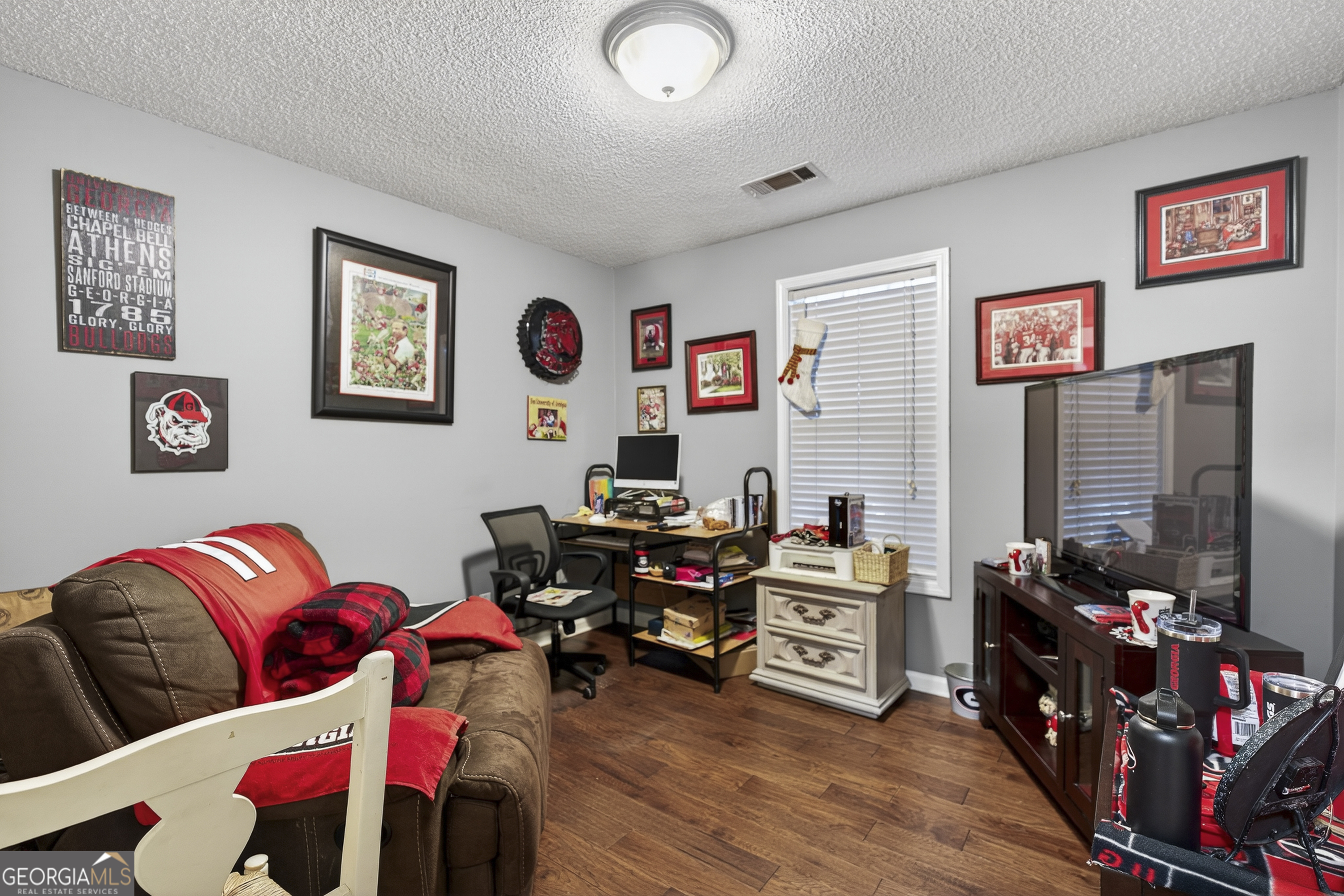 249 Southern Walk Circle Gray, GA 31032 - Photo 44 of 58 a living room with furniture and a flat screen tv