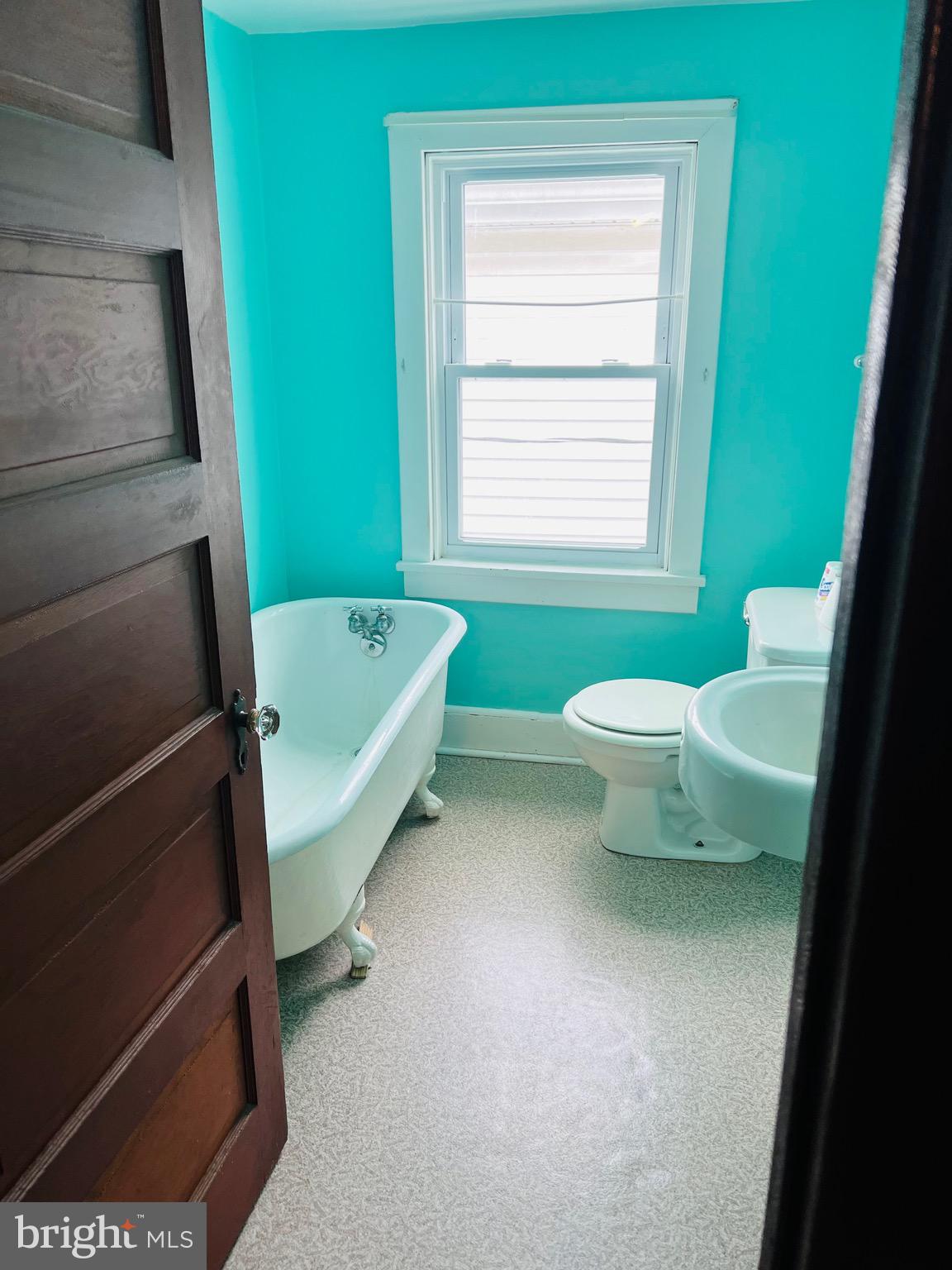 317 West Commerce Street Smyrna, DE 19977 - Photo 22 of 30 a bathroom with a sink toilet and window