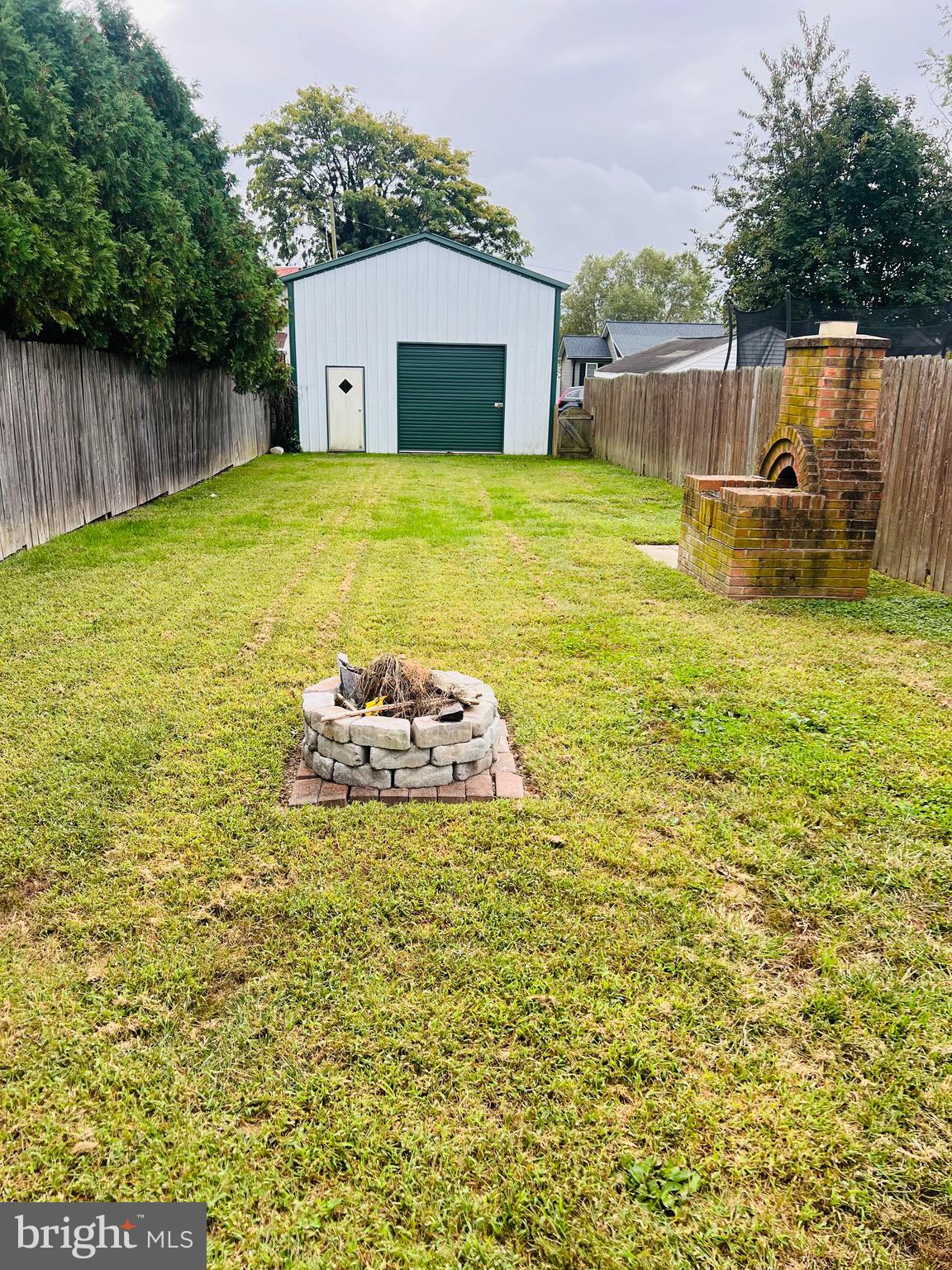 317 West Commerce Street Smyrna, DE 19977 - Photo 23 of 30 a swimming pool with trees in the background