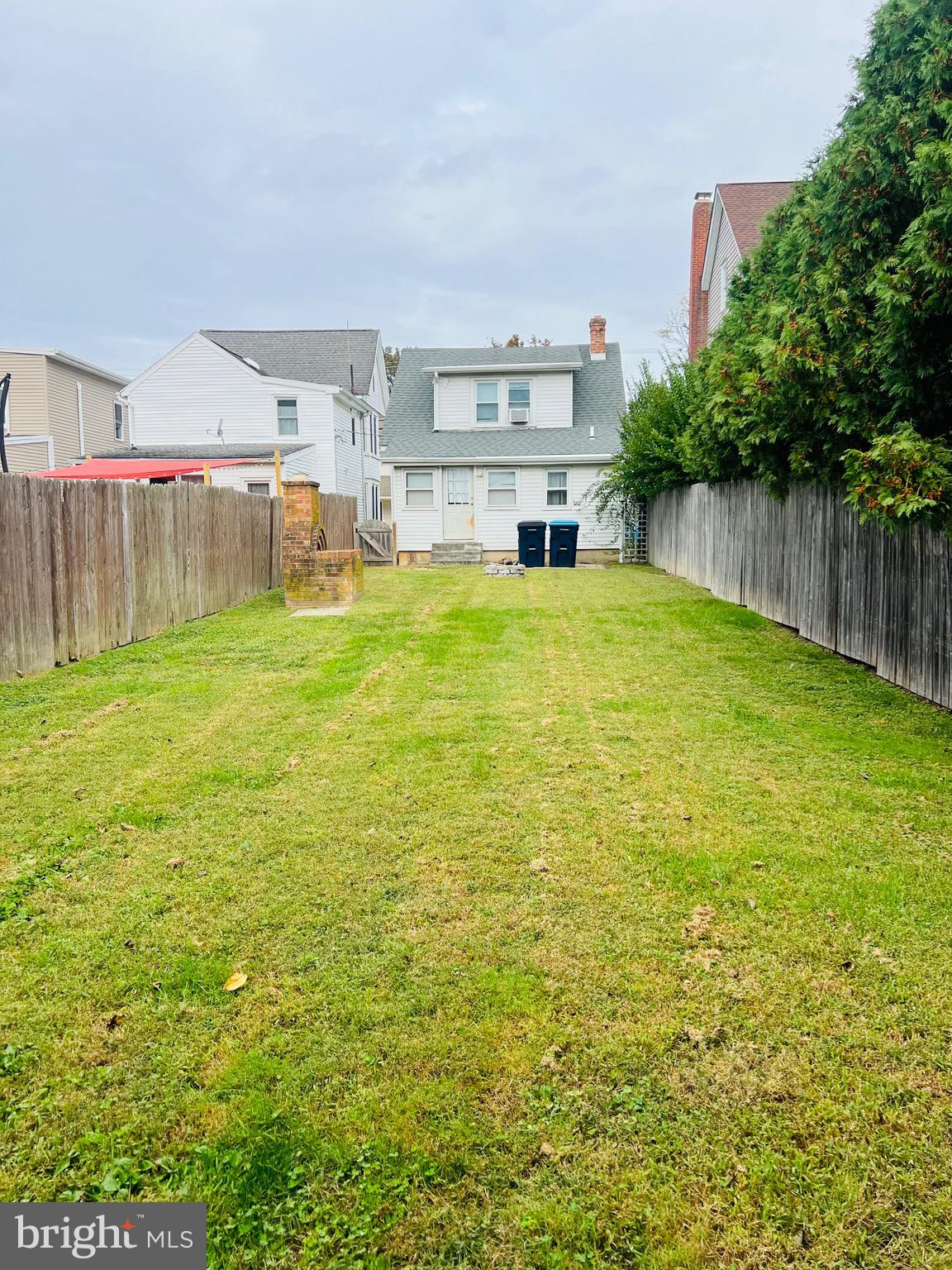317 West Commerce Street Smyrna, DE 19977 - Photo 25 of 30 a swimming pool with plants and trees in front of it