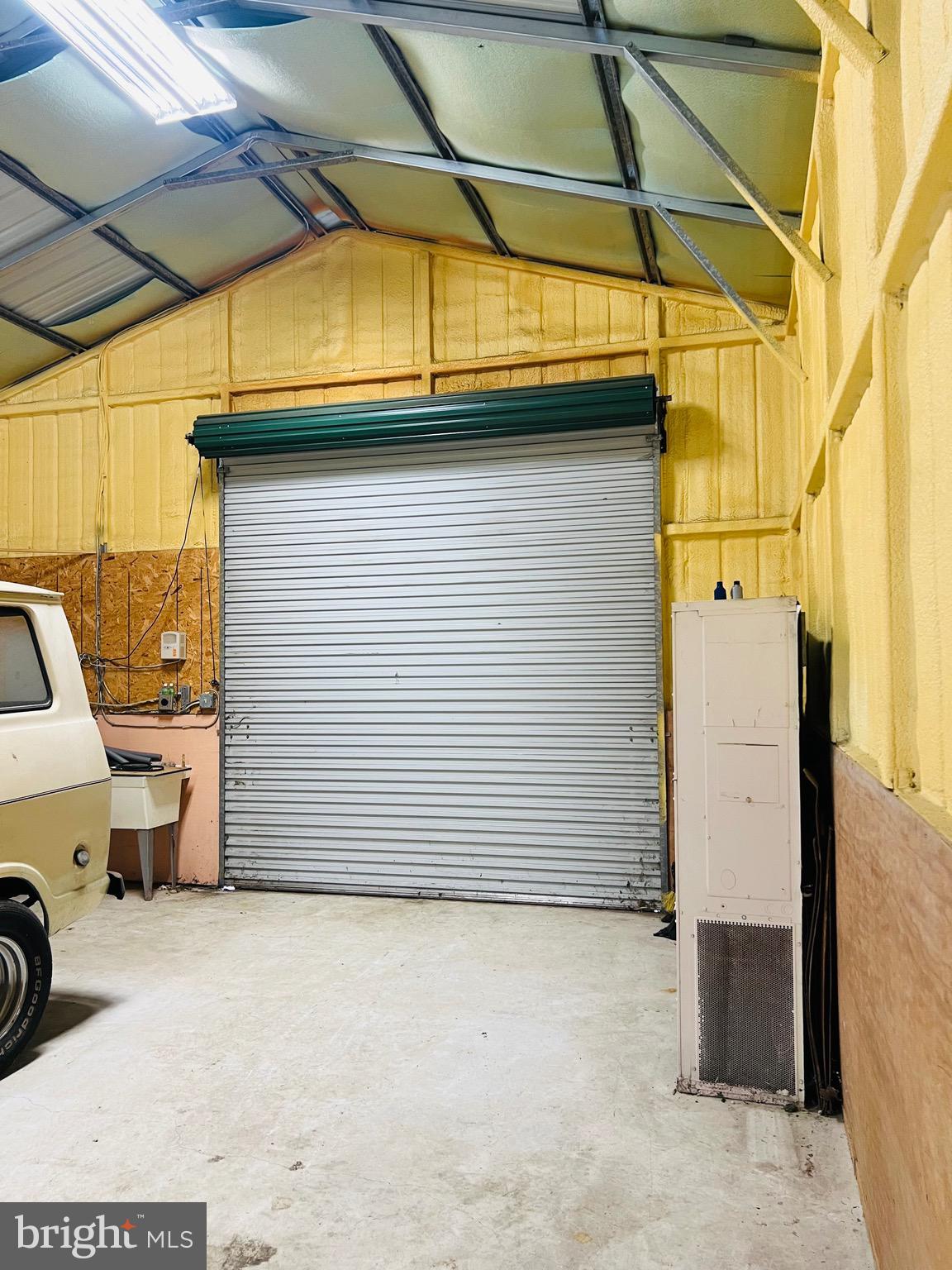 317 West Commerce Street Smyrna, DE 19977 - Photo 27 of 30 a view of a garage with parked cars