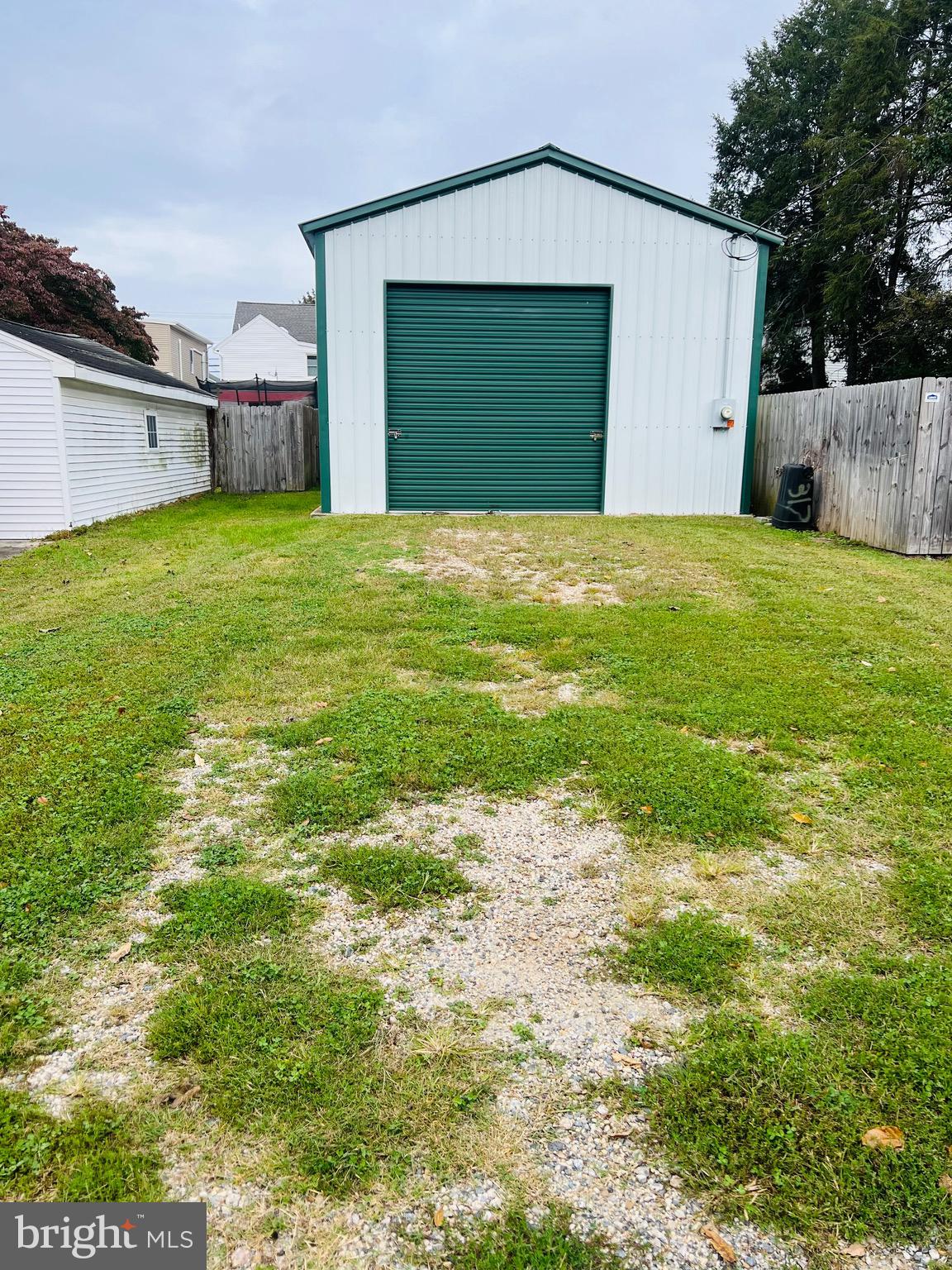 317 West Commerce Street Smyrna, DE 19977 - Photo 29 of 30 a view of a house with a yard and garage