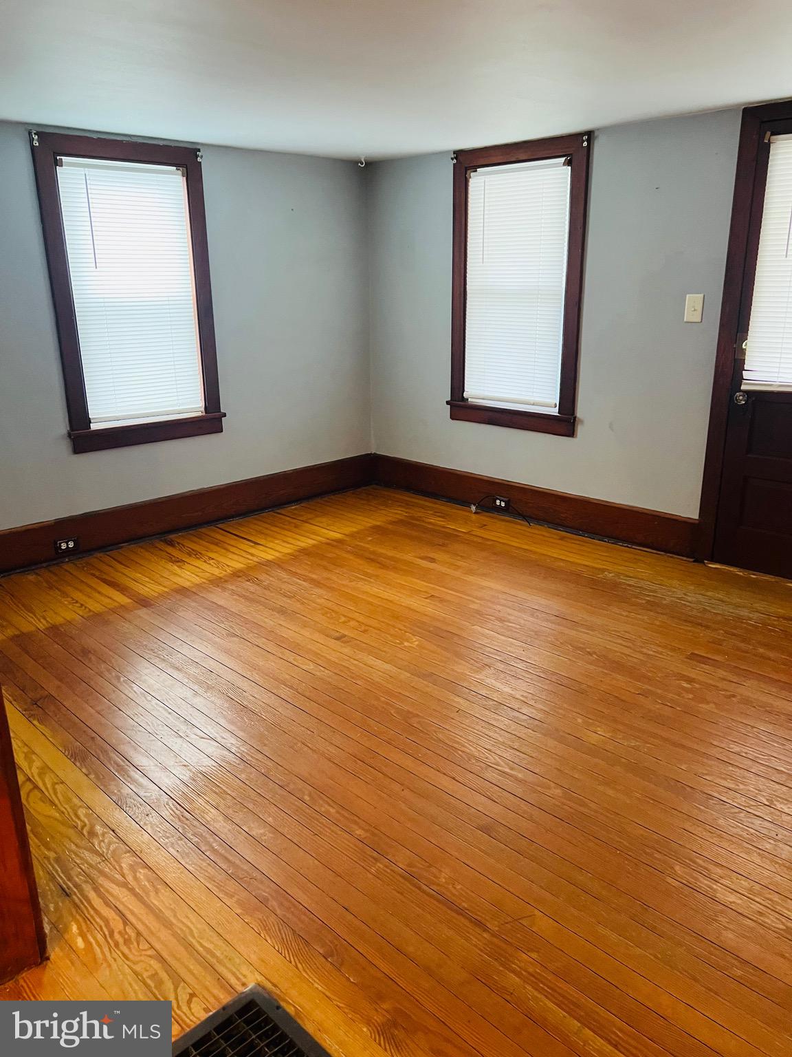 317 West Commerce Street Smyrna, DE 19977 - Photo 7 of 30 a view of a room with wooden floor and window