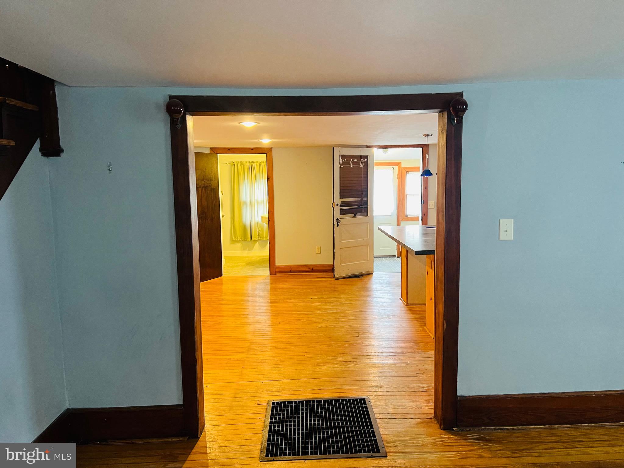 317 West Commerce Street Smyrna, DE 19977 - Photo 10 of 30 a view of an empty room with wooden floor and a window