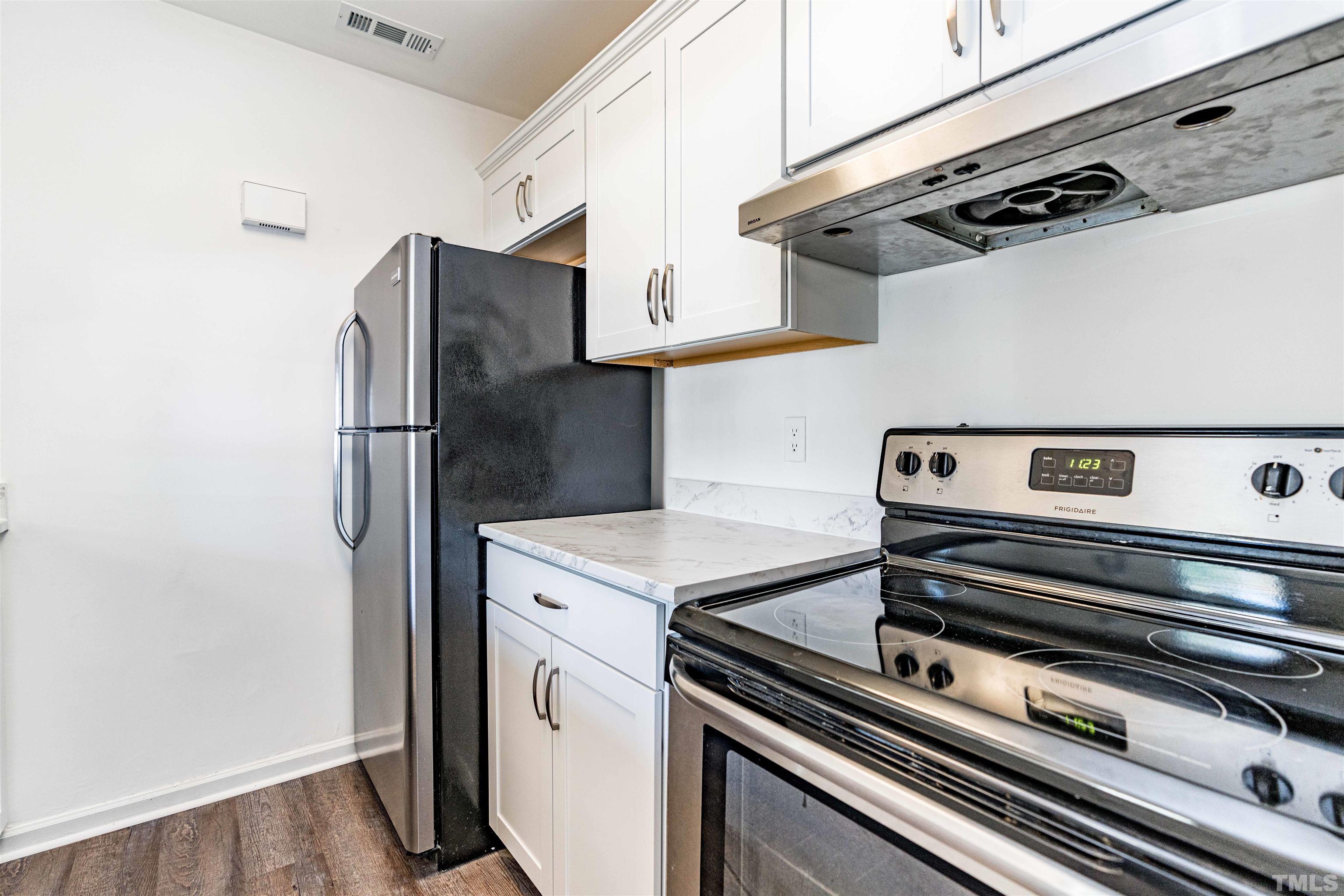 3643 Mill Run, Unit 3643 Raleigh, NC 27612 - Photo 11 of 25 a kitchen with appliances and a cabinets
