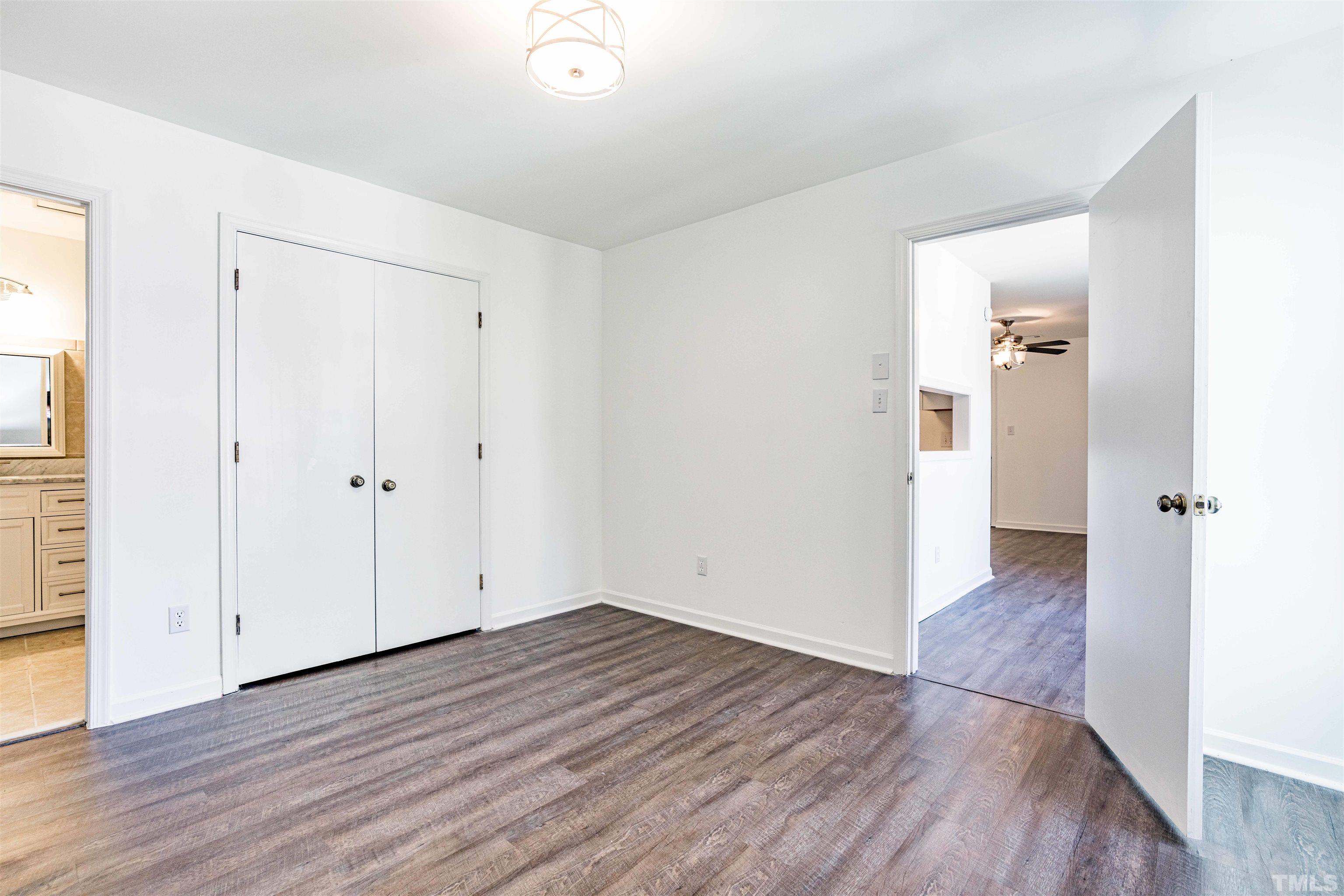 3643 Mill Run, Unit 3643 Raleigh, NC 27612 - Photo 17 of 25 an empty room with wooden floor & windows