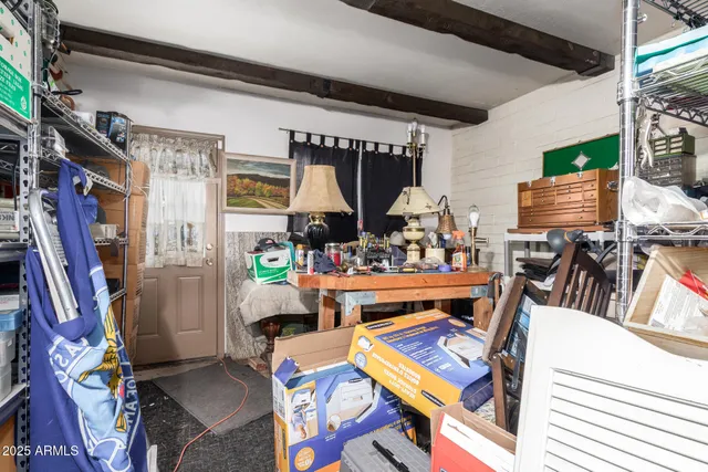 a view of a chairs and table in a patio