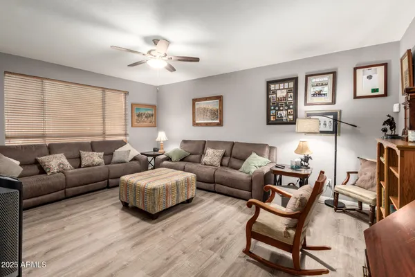 a living room with furniture and a large window