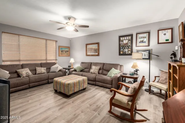 a living room with furniture and a large window