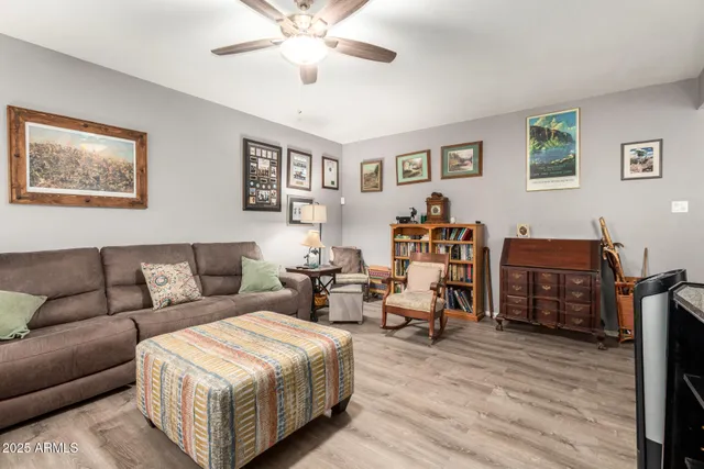 a living room with furniture and wooden floor