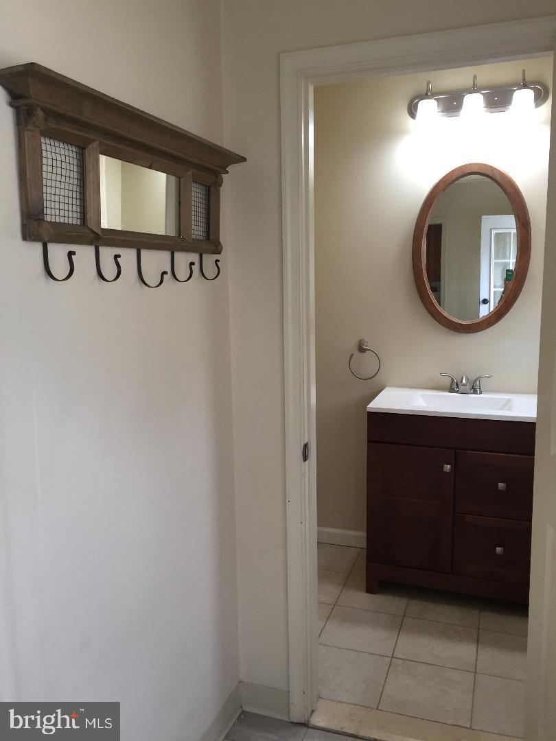 336 East Manoa Road Havertown, PA 19083 - Photo 17 of 23 a bathroom with a sink and a mirror