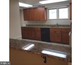 336 East Manoa Road Havertown, PA 19083 - Photo 10 of 23 a kitchen with granite countertop cabinets and window