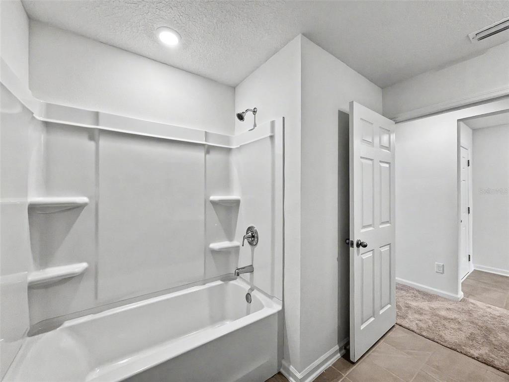 55 Signet Circle Flagler Beach, FL 32136 - Photo 37 of 39 a bathroom with a bathtub and a shower