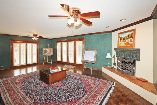 a living room with furniture a rug and a fireplace