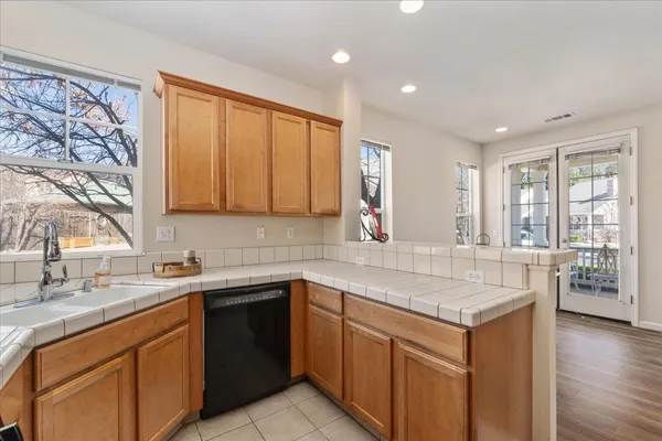 a kitchen with a sink stove and cabinets