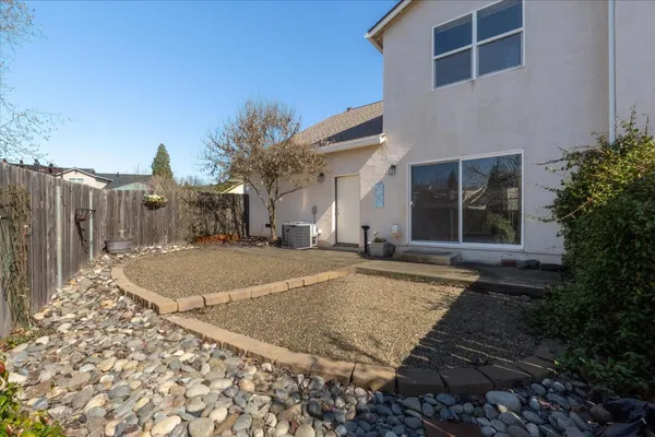 a view of a house with a yard and garage