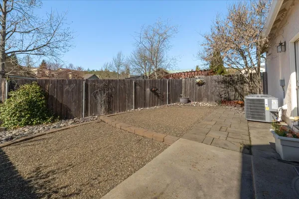 a view of a backyard of the house