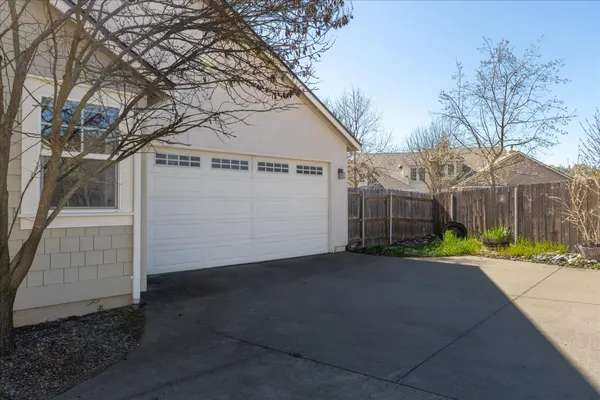 a view of a house with a yard and sitting area