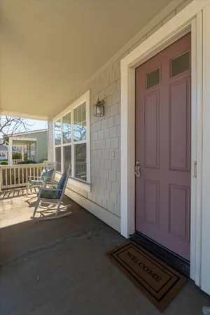 a view of backyard with a table and chairs
