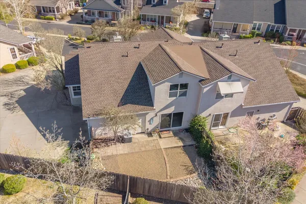a aerial view of a house with table and chairs