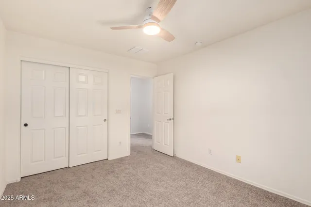 an empty room with a empty space and windows