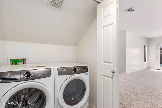 an empty room with a empty space and windows