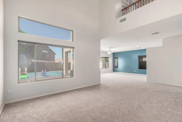 a kitchen with stainless steel appliances granite countertop a sink a stove and microwave