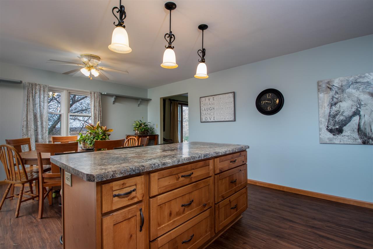 14500 Saunders Road Pecatonica, IL 61063 - Photo 10 of 19 a kitchen with a table and a chandelier