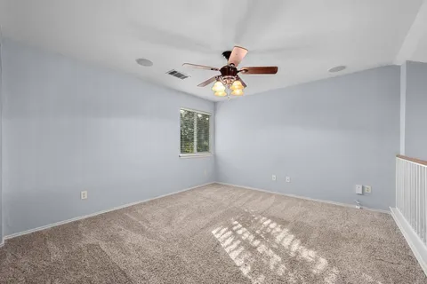 a view of a big room with a window