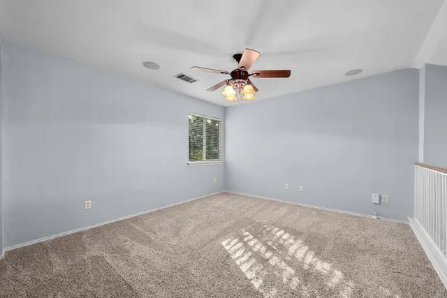 a view of a big room with a window