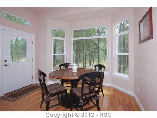 9540 Morgan Road Colorado Springs, CO 80908 - Photo 8 of 25 Dining nook with walk out to deck